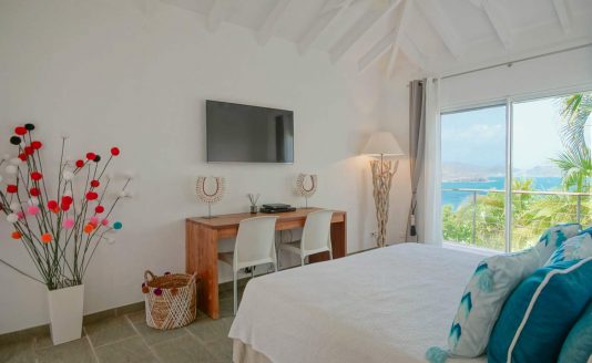 Nice bedroom with a king bed in the Heloa Villa in St Barth