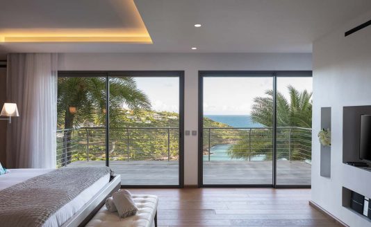 bedroom with ocean view in the mythique villa in st Barth